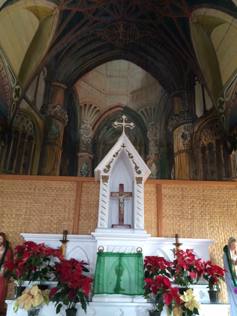 Altar at Painted Church. The apparently extended space behind is a mural.