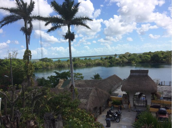 Cenote Azul in the foreground. The water beyond is Laguna Bacalar; the cenote and the lake are separated only by a thin strip of land.